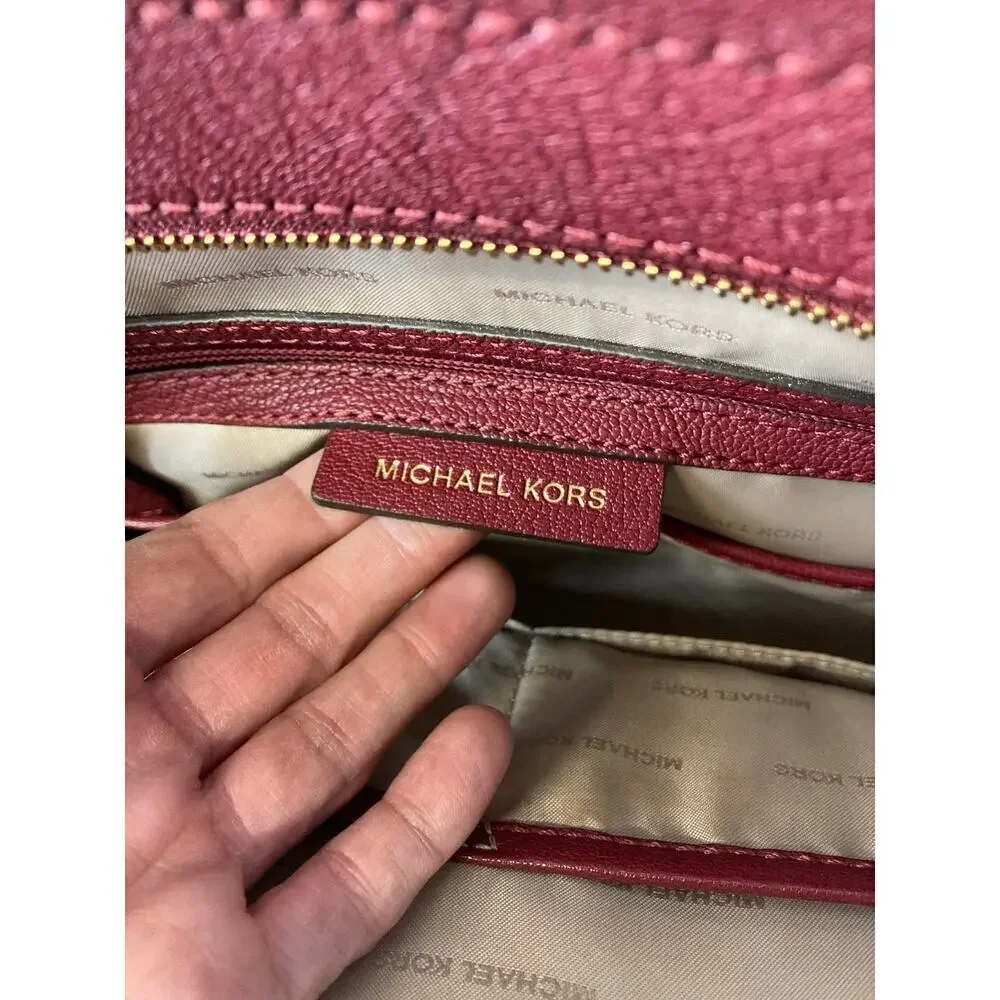 MICHAEL KORS, LARGE WINE LEATHER HANDBAG WITH LOCK CHARM.
